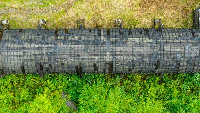 Summer aerial view featuring the 3.4 mile long wooden penstock in Vermont known as The Snake that runs from the Searsburg Dam to a generating station along the Deerfield River with an 8 foot diameter