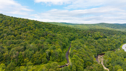Summer aerial view featuring the 3.4 mile long wooden penstock in Vermont known as The Snake that runs from the Searsburg Dam to a generating station along the Deerfield River with an 8 foot diameter
