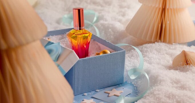 Deep drifts nestle the perfume Christmas gift.