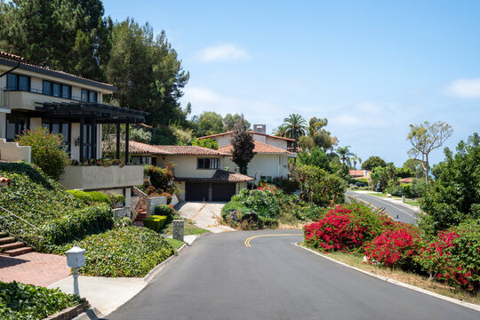 Charming Palos Verdes Estates street with Spanish-style homes and lush landscaping