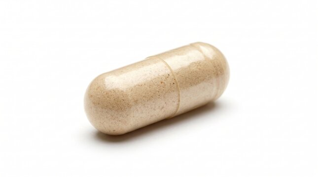 One single beige herbal medical capsule pill for health and wellness
