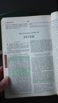 Kuala Lumpur, Malaysia - Sept 10, 2026: Opening to the book of 2 Peter, of the New Testament in the Holy Bible. New Revised Standard Version. Vertical video.
