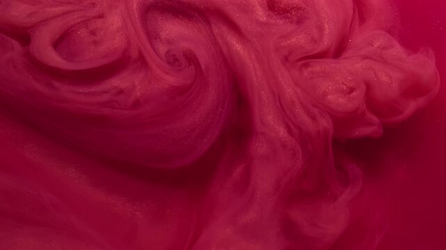 Watercolor explosion. Paint vapor. Glossy spiral swirl red cloud color vortex. Art bright sparkling fluid blend defocused background.