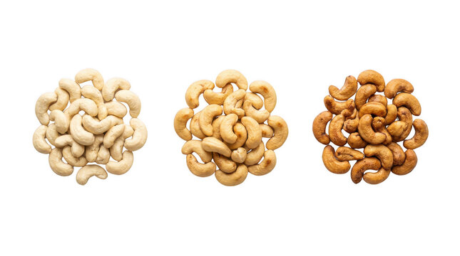 Three piles of raw roasted and salted cashew nuts arranged in a row as a healthy organic snack food ingredient