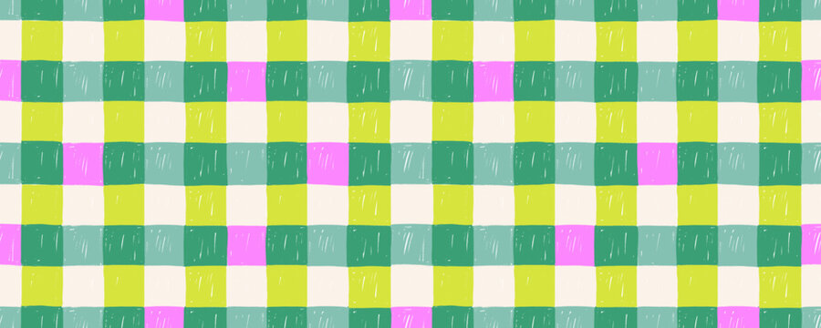 Christmas tartan plaid seamless pattern. Crayon drawn green and pink squares. Hand drawn checkered plaid tattersall pattern. Tablecloth seamless wallpaper or wrapping paper with pencil dry texture.