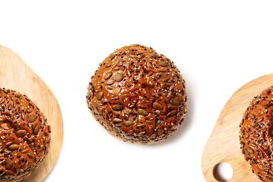 Healthy multigrain bread bun topped with mixed seeds and grains