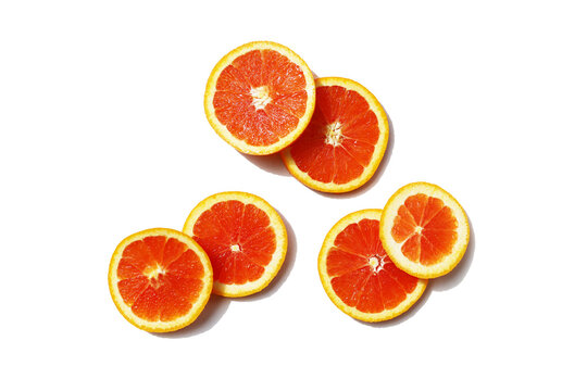 Juicy Cara Cara orange slices on a white background.