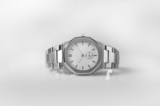 Modern Silver Wrist Watch with White Dial, Metal Bracelet and Geometric Case on White Background