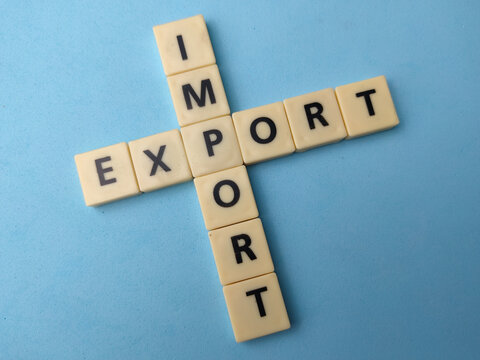 Beige letter tiles spell out IMPORT vertically and EXPORT horizontally, intersecting at the letter P on blue