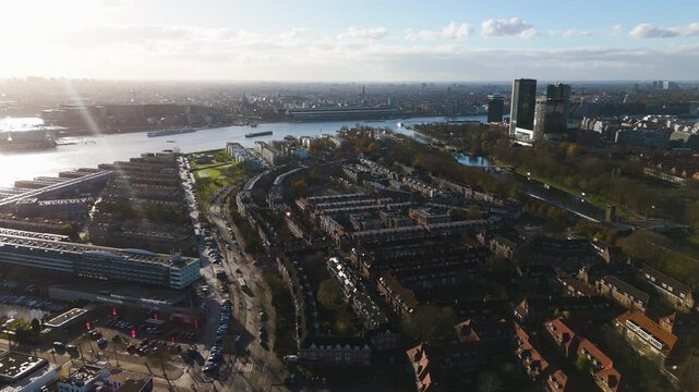 Aerial view overlooking the IJ river and modern city skyline in Amsterdam.