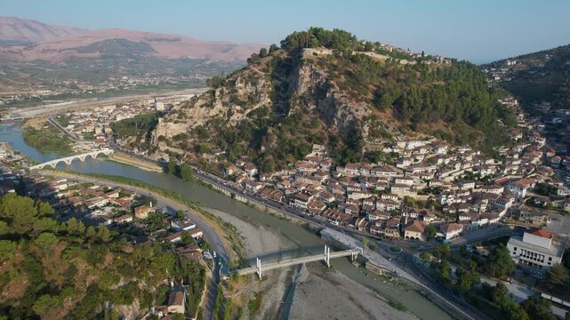 Picturesque drone landscape of Berat city neighborhoods showing authentic stone houses and ancient bridges