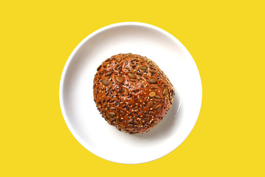 Healthy multigrain bread bun topped with mixed seeds and grains