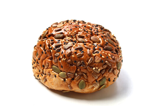 Healthy multigrain bread bun topped with mixed seeds and grains