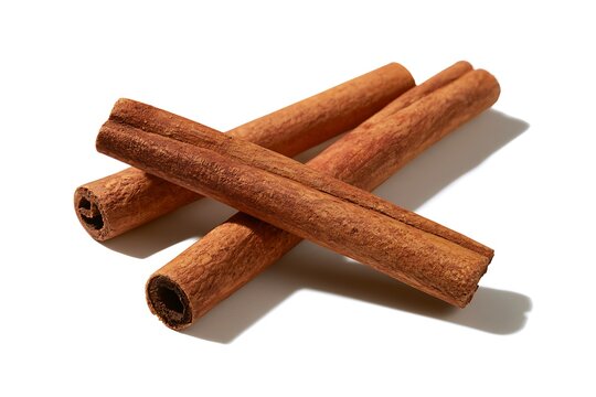 Three aromatic cinnamon sticks arranged together isolated on white background