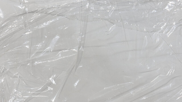 Transparent plastic wrap texture overlay effect. Realistic crumpled wrinkled film background.
