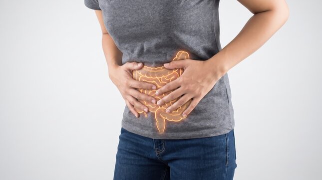 Woman holding her stomach in pain with a glowing orange outline of the digestive system superimposed on her abdomen, representing gut health issues and discomfort.
