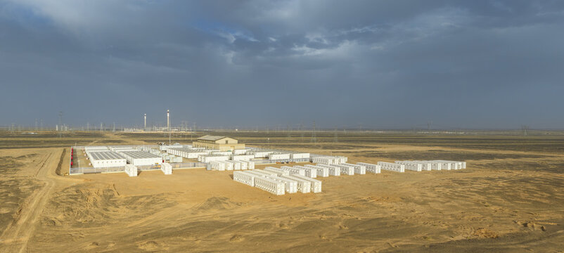 Large-Scale Energy Storage Power Station in Gobi Desert at Dusk with Molten Salt Solar Towers