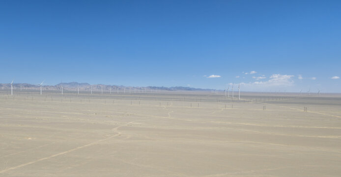 Renewable Energy Wind Turbines Spanning Endless Barren Desert Plains in China