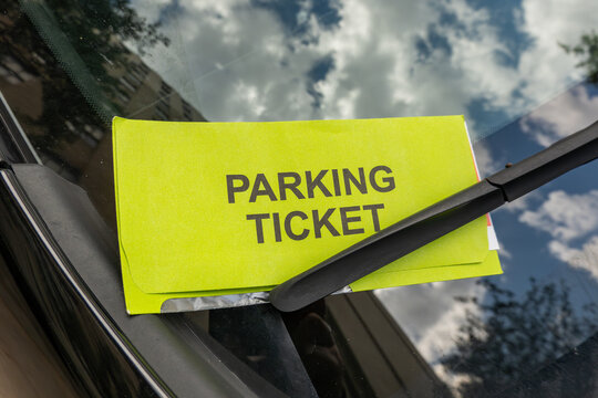Richmond, Virginia, USA A parking ticket on the windsh&iacute;eld of a car.