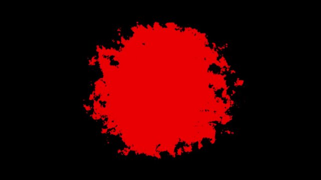 Vibrant red ink blot expanding on black background, abstract liquid motion splash