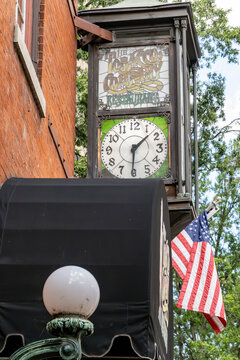Richmond, Virginia, USA Old red brick buildings in the East Cary Street district and an old clock above the Tobacco Company Restaurant entrance.