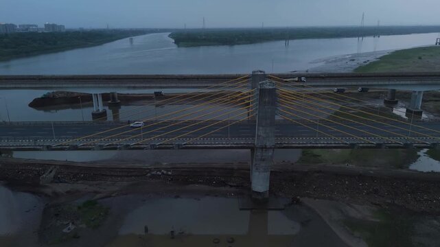Aerial drone view of modern cable stayed bridge and transportation infrastructure over water in Bharuch Gujarat India