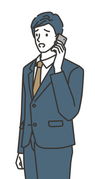 仕事の問題について電話で相談する困ったビジネスマン
