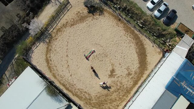 People horseback riding at a riding center_01