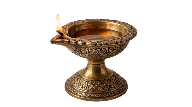 Traditional brass oil lamp with a glowing flame, lit for Hindu festival celebrations, meditation, and spiritual rituals on white background