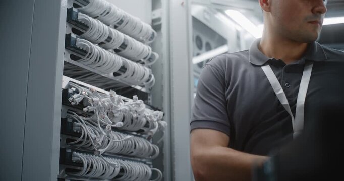 IT Engineer Performs Network Switch Replacement In 19 inch Server Rack, Aligning Active Equipment with Mounting Rails Before Fastening Hardware For Reliable Connectivity and Infrastructure Service.