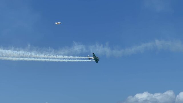 Vintage Lockheed Hudson Military Aircraft Performing Aerobatics with Smoke Trails
