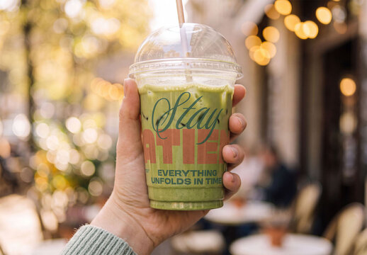 Transparent plastic take away cup Mockup in Hand