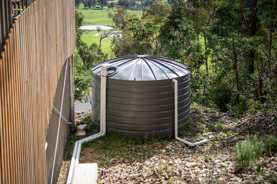 Rural Water Storage Tank Amidst Lush Greenery