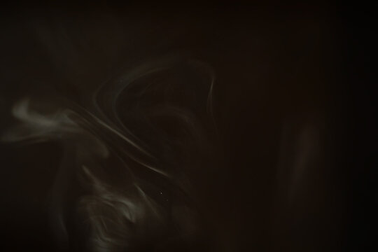 Abstract Dark Smoky Texture with Ethereal Wisps in Low Light Atmosphere