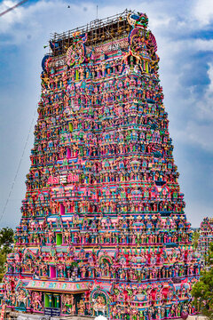 Detailed view of the richly sculpted gopuram of Madurai Meenakshi Amman Temple during preparations ahead of the Thirukkudamuzuku, a sacred Hindu Kumbabhishekam consecration ceremony