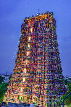 Night view of the illuminated gopurams of Madurai Meenakshi Amman Temple during preparations for the Thirukkudamuzuku, a sacred Hindu Kumbabhishekam consecration ceremony