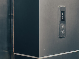 Close-Up of Elevator Floor Button Panel with Up-Down Arrows and Digital Display © Tavan