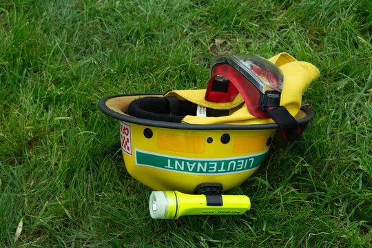 a yellow CFA Lieutenant's firefighting helmet on the grass