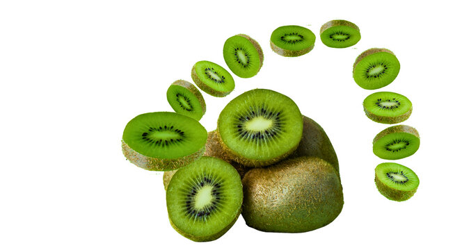 Whole kiwi fruits with flying round slices isolated transparent png