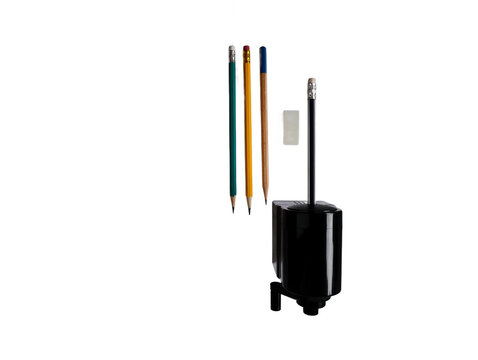 Three pencils eraser and pencil sharpener isolated on white