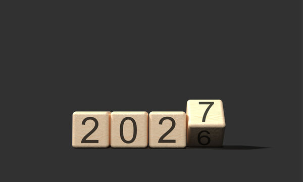 Wooden blocks turning from 2026 to 2027 on a dark gray background
