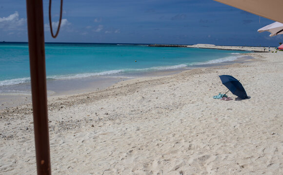 Beautiful turquoise tropical beach in a holidays scene in Gulhi, Maldives