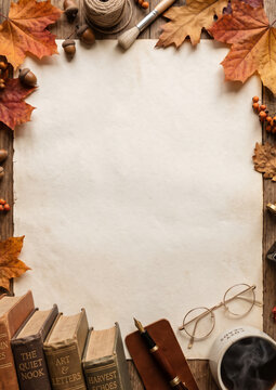 Cozy autumn reading frame with vintage books spectacles and coffee cup Vertical
