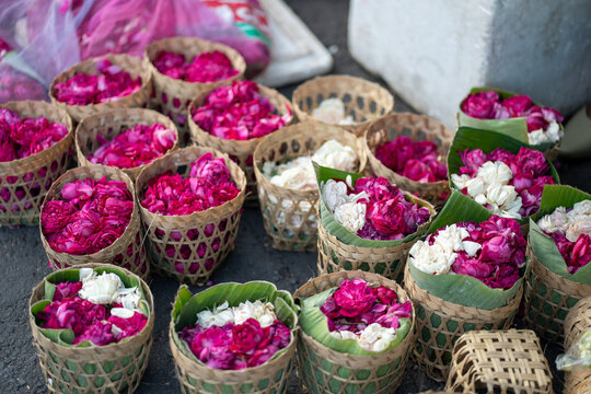 Balinese canang sari offerings with colorful flowers