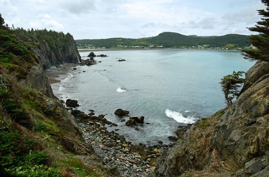 looking out across big chance cove, to rocky  chance cove beach and turquoise-colored water from the cliffs while hiking the chance cove coastal trail  on the isthmus of  avalon peninsula  in newfound