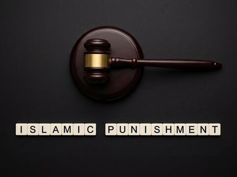Wooden gavel with Islamic Punishment text block suitable for legal media representing religious law enforcement and sharia justice system
