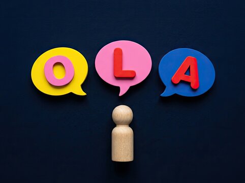 Wooden figure with speech bubbles spelling OLA suitable for language learning content symbolizing friendly greetings and global communication