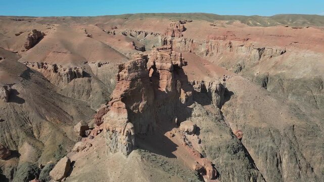 Scenic aerial view of the majestic charyn canyon in kazakhstan. Vast desert landscape featuring stunning red rock formations and deep ravines