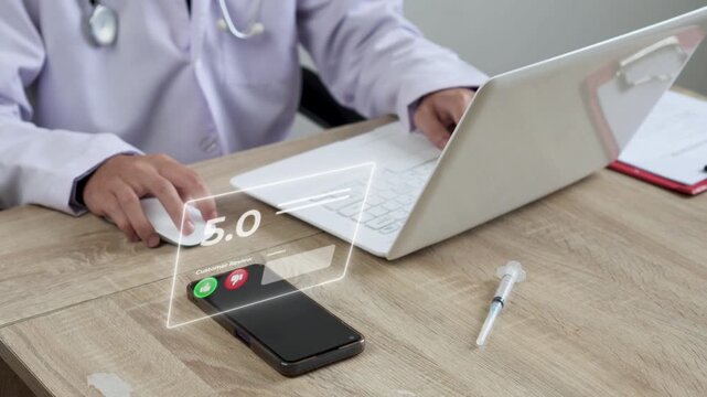 Doctor using mouse and laptop with Digital customer review interface peep out on smart phone