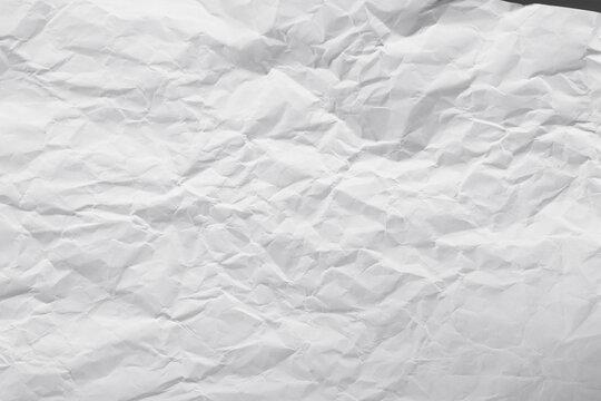 Texture crease of white paper for template wallpaper. wrinkle of gray paper crumpled background.